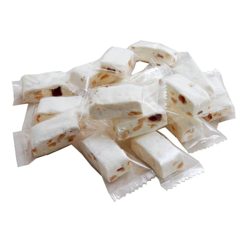 Härligt seg och mjuk Fransk nougat med jordnötter och kanderad frukt. Kommer förpackade i genomskinlig cellofanpåse som innehåller 10 st bitar.