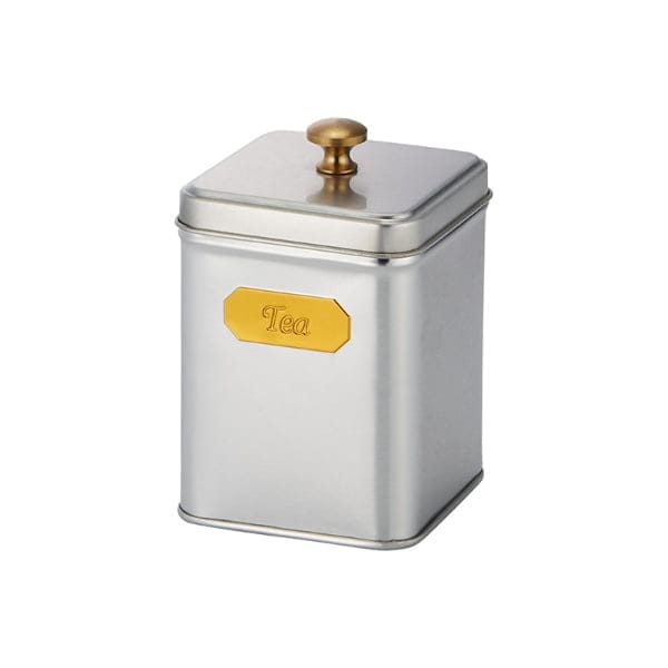 Burk i plåt med lock. Mått 10 x 6,5 x 6,5 cm (hxbxd). Burken rymmer ca 100 g te.