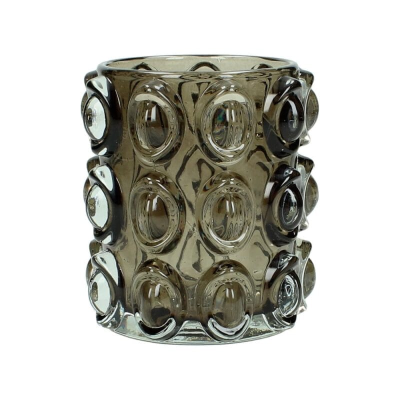 Ljuslykta i gråtonat glas med reliefmönster. Tung och gedigen modell som ger ett mjukt, dämpat sken. Ø 10 cm, höjd 11 cm.