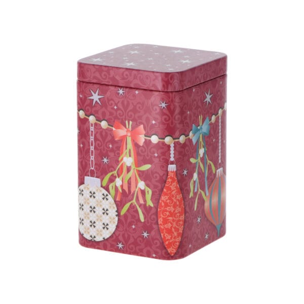 Vacker teburk i plåt med juligt motiv. Den fina rödrosa bakgrunden framhäver motivet och ger burken en harmonisk julkänsla.